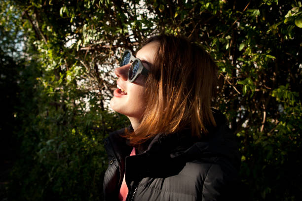 istock Girl with autumn sunlight 876966664