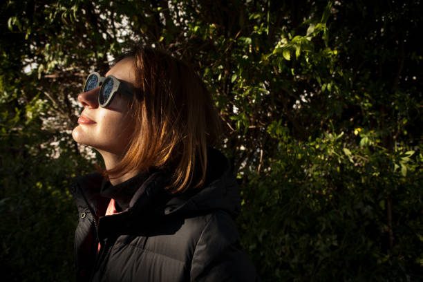 istock Girl with autumn sunlight 876966678