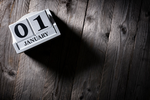 January 1st calendar on wood background new year concept