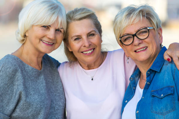 istock Group of elderly friends posing together 876970544