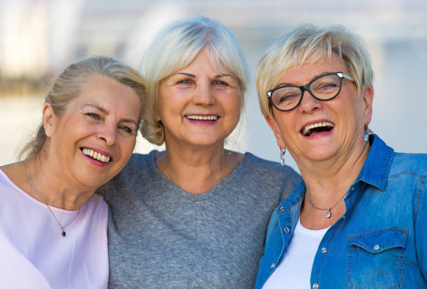 istock Group of elderly friends posing together 876970552