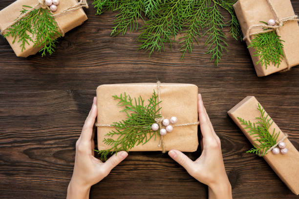 istock Female hands holding Christmas gift 876971070