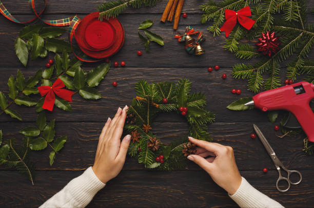 istock Prepare for xmas, creative craft wreath. Making christmas symbol 876972146