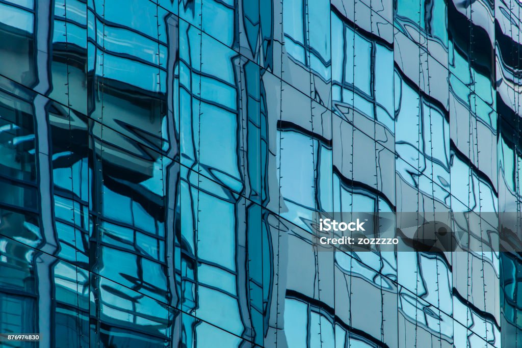 office building windows detail Modern office building in Budapest, windows with reflections Building Exterior Stock Photo
