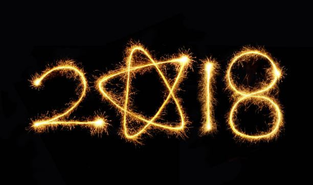 istock New Year 2018 sparkler on a black background 876981658