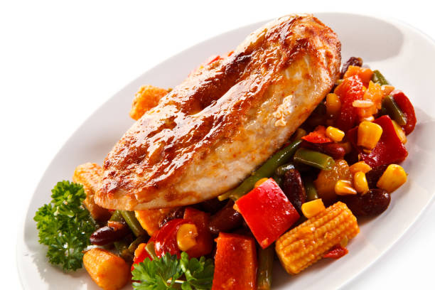 istock Grilled chicken fillet and vegetables on white background 876981860