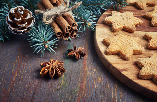 istock Christmas background with Christmas tree twigs, star-shaped cookies 876987230