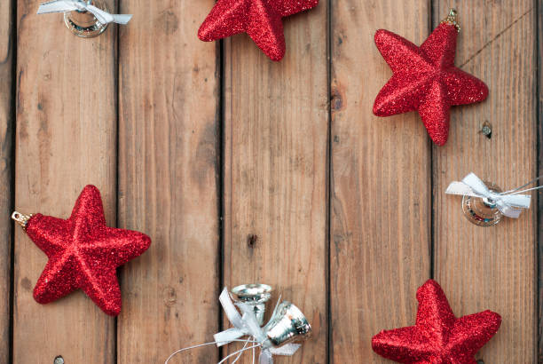 istock Christmas decorations. Red Christmas star on rustic wooden background 876989586