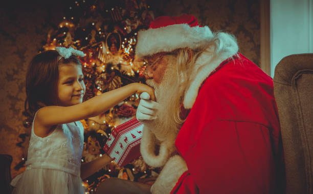 istock Santa Claus gives presents 876990658