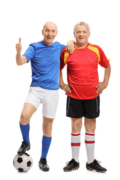 istock Two elderly soccer players with one of them making a thumb up gesture 876994514
