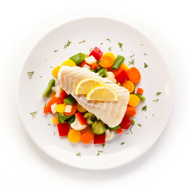 istock Fish dish - fried fish fillet and vegetables 876994688