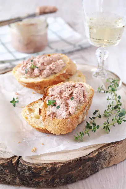 French rillettes: meat pate with bread and glass of white wine, appetizer