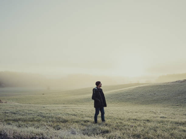 istock Man out with his car in winter nature landscape 876998816