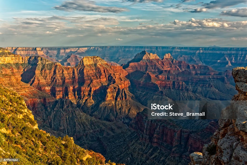 Dark clouds gather over the Grand Canyon. As the sun sets dark clouds gather in the sky over the Grand Canyon. Grand Canyon Stock Photo