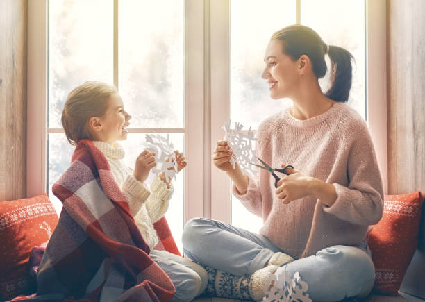istock family sitting by the window 877002302