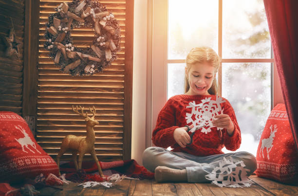istock girl sitting by the window 877002402
