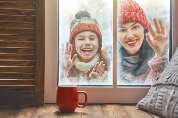 istock family on snowy winter walk 877002408