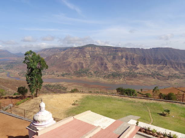 istock Scenic view of landscape against sky 877009996