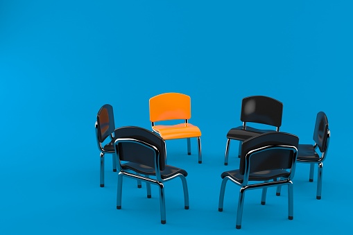 Chairs in circle isolated on blue background