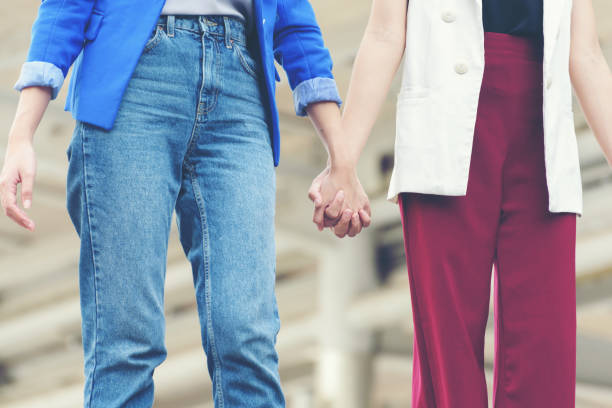 istock Women hold hands ,Successful team: many hands holding together,teamwork group 877018530
