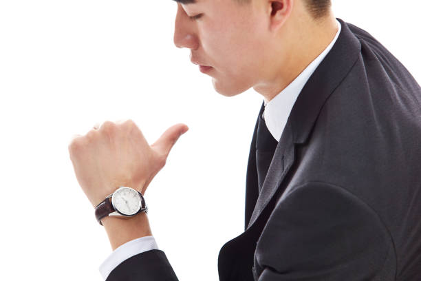 istock asian business man looking at watch 877018908
