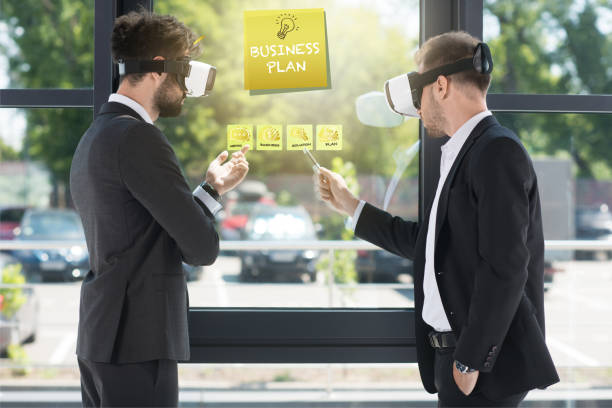 istock businessmen with vr headsets 877019062