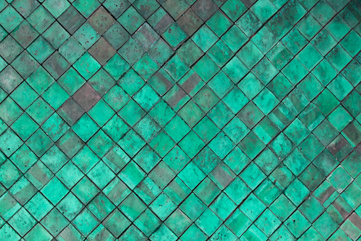 Old Green Terracotta tiles wall for texture and background