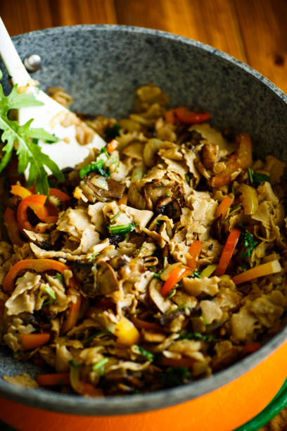 istock Buckwheat noodles with fried mushrooms and vegetables 877019908