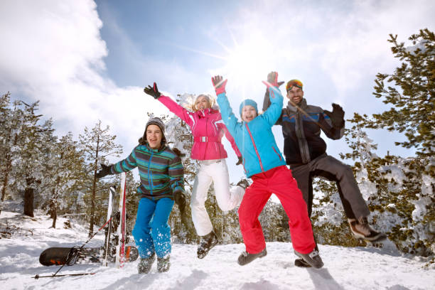 istock Family on skiing jumping on snow 877026668