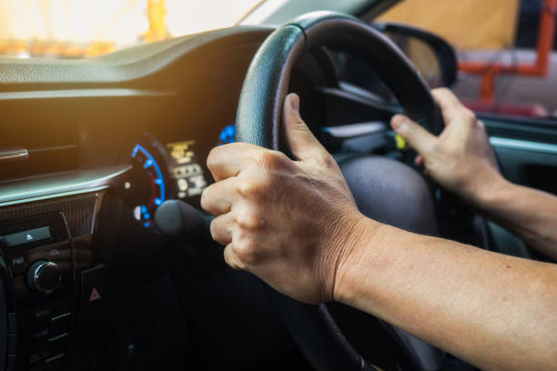 istock Male driving car on day time, vintage filter 877027150
