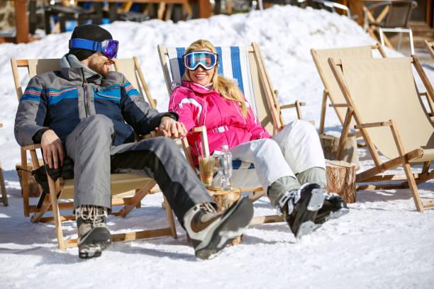 istock Couple enjoy at sun on ski terrain 877027160