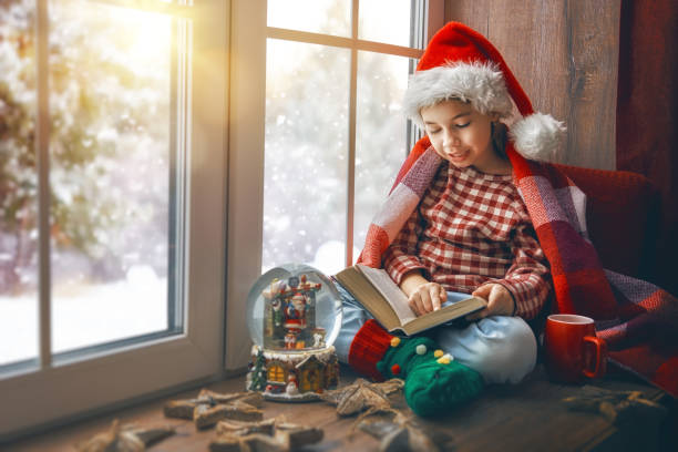 istock girl sitting by the window 877027416