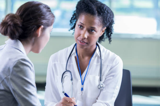 istock Psychiatrist listens to patient with compasssion 877029554
