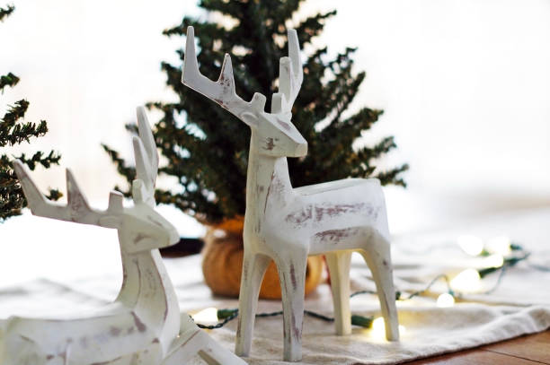 istock Deer Christmas decorations with lights and trees 877029812