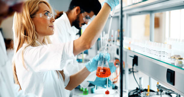 istock Female student of chemistry working in laboratory 877031018