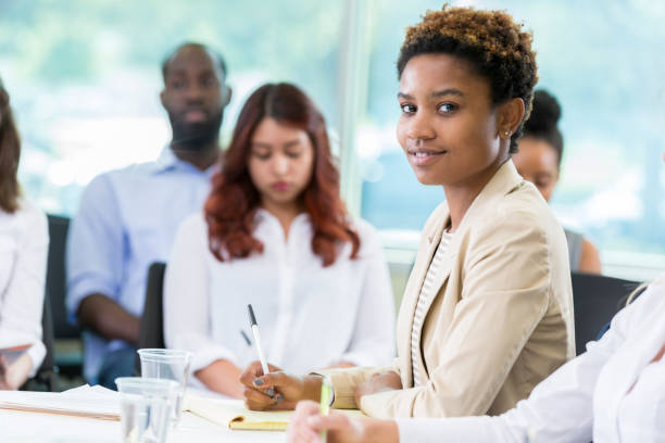 istock Attractive young businesswoman attending seminar 877031406