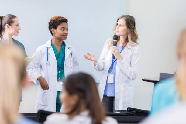 istock Confident doctor addresses colleagues during conference 877033704