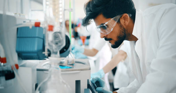 Young students of chemistry working in laboratory Young students of chemistry working together in laboratory biochemist photos stock pictures, royalty-free photos & images