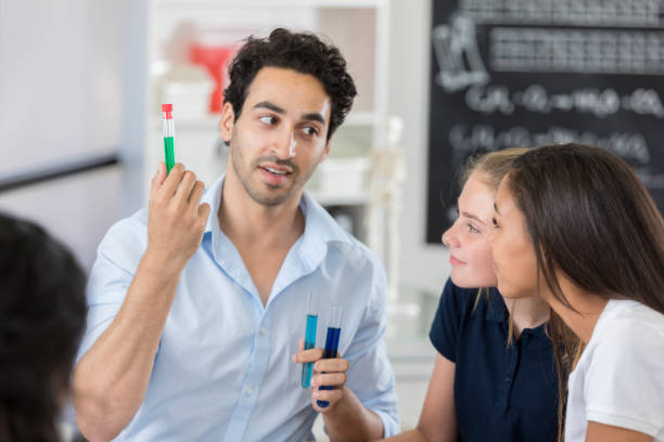 istock Confident high school STEM school teacher in chemistry lab 877033910