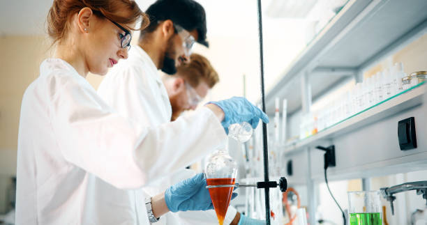 istock Young students of chemistry working in laboratory 877034036