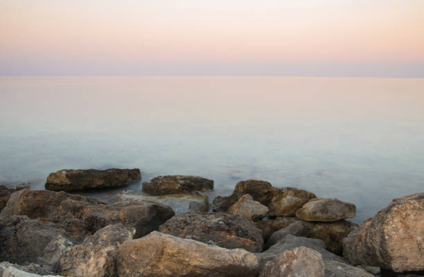 The rocks with long exposure shooting wave stock photo