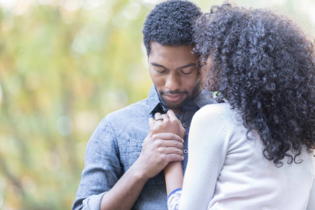 istock Newly engaged couple in the park 877034472