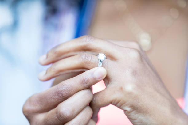 istock Newly engaged woman shows off diamond ring 877034474