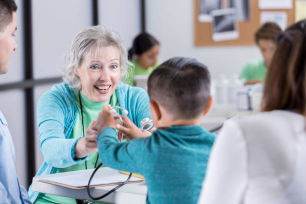istock Little boy is curious about his pediatrician's stethoscope 877034636