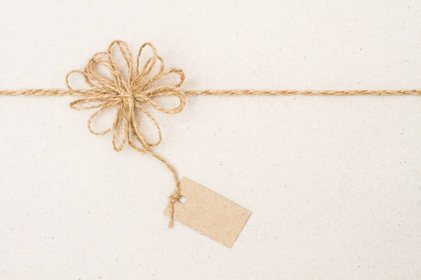 istock Paper Tag Label and Rope Bow Decoration, Gift Wrapping Paper, Twine String Ribbon 877037568