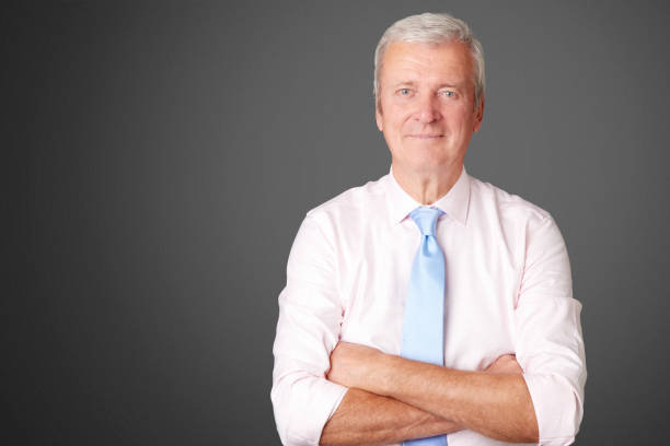 istock Smiling senior businessman portrait 877056284