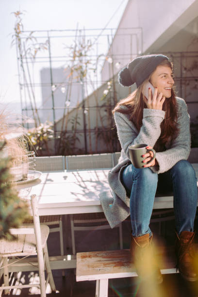 istock Young woman talking on a mobile phone 877065184