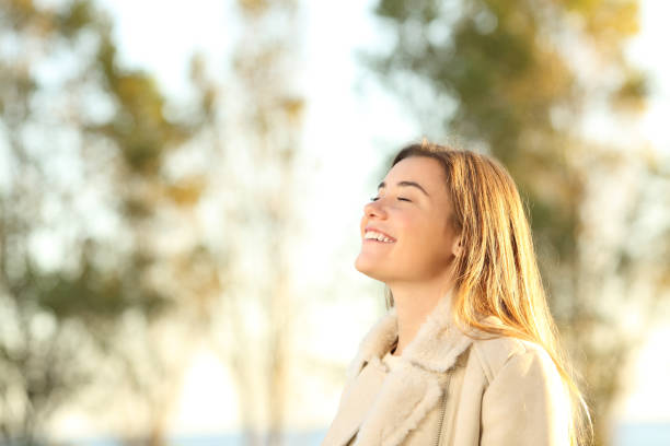 istock Girl breathing fresh air wearing jacket 877068112