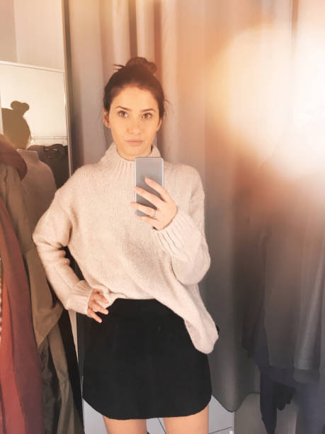 istock Young woman in a fitting room 877068282