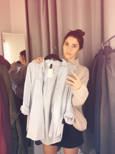 istock Young woman in a fitting room 877068594